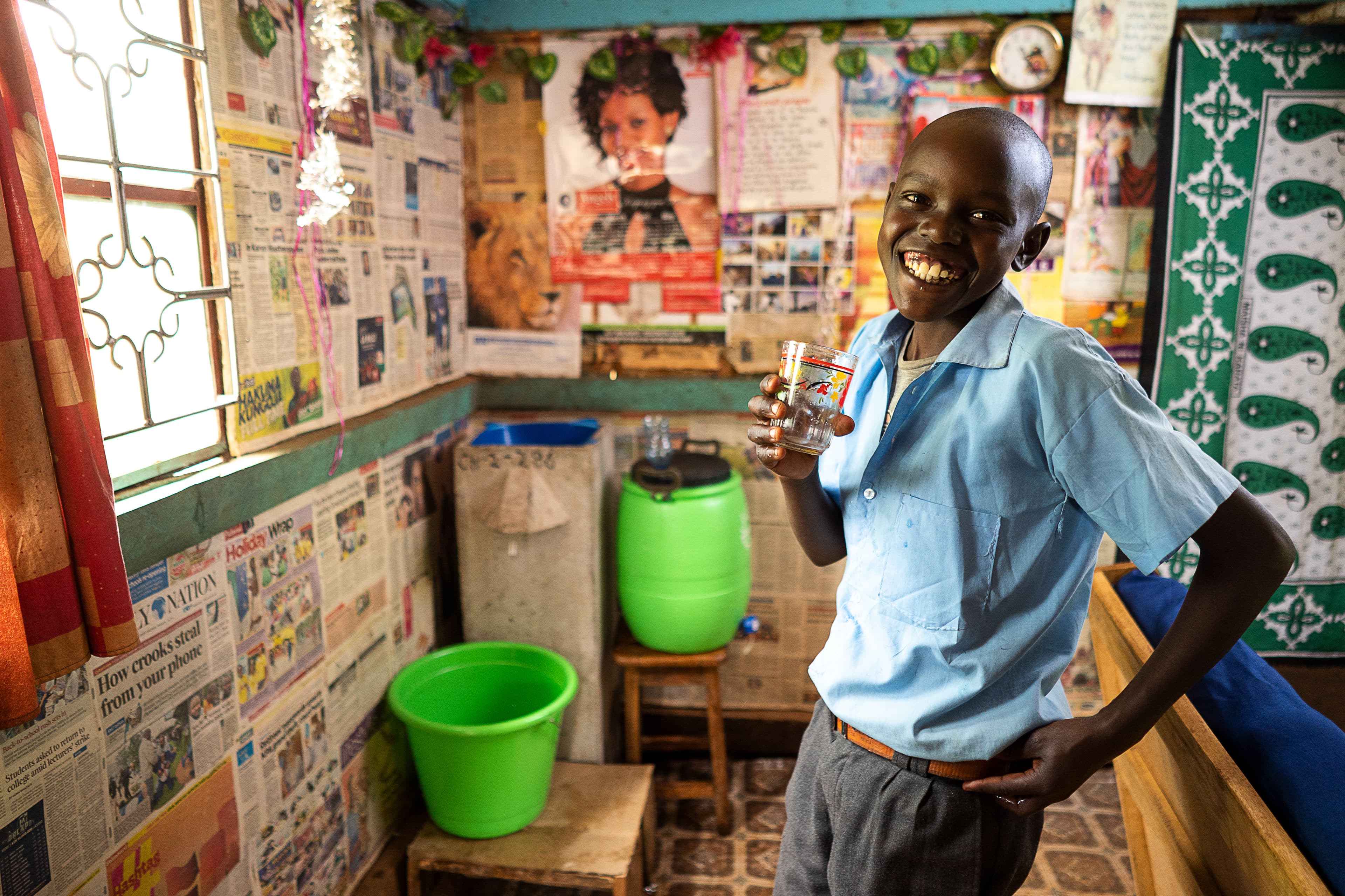 Philip’s son enjoys drinking clean water from a household filter provided by Samaritan’s Purse.