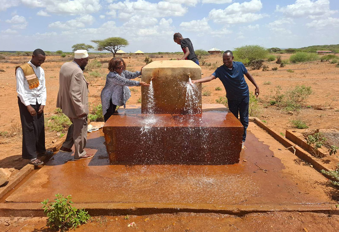 Somali Government Official Standing at a new well.