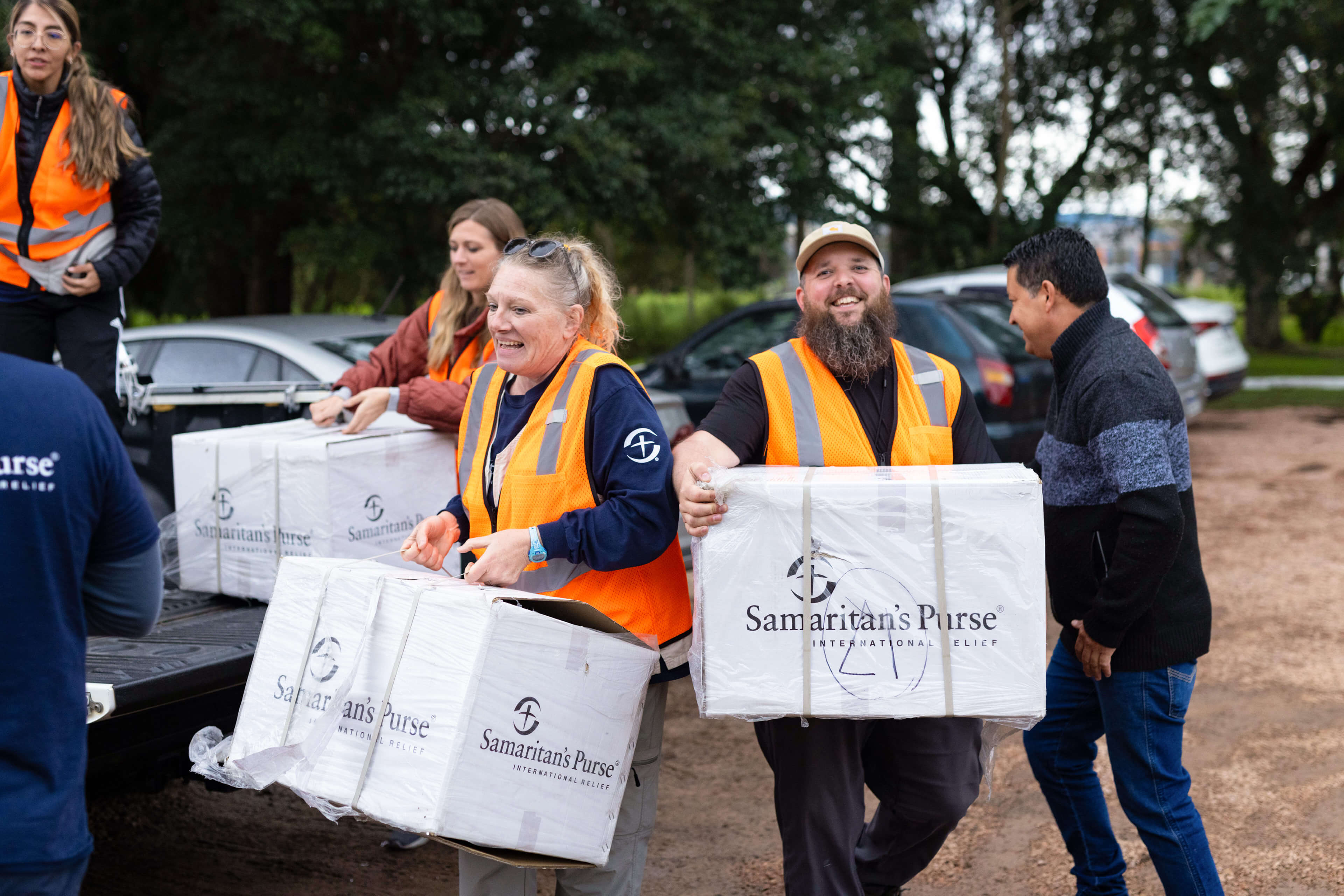 Man unloading truck with Samaritan's Purse International Relief box.