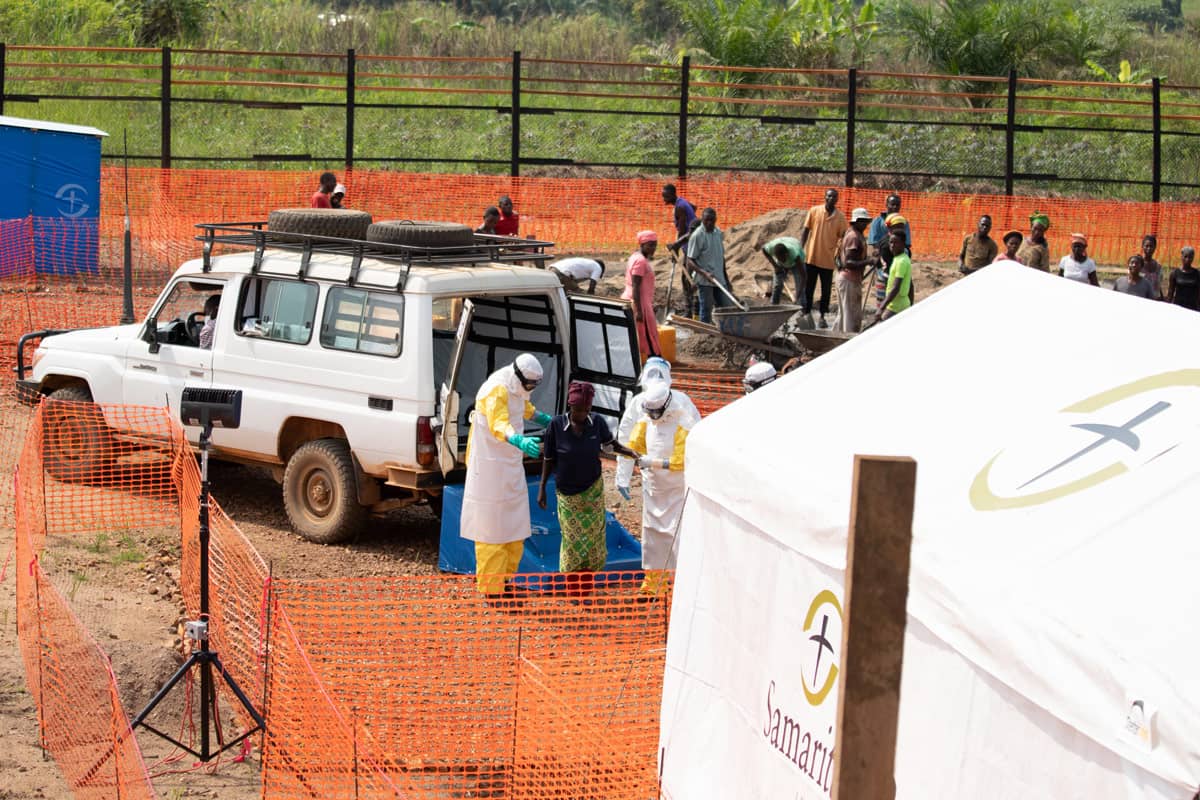 A group of medical workers assisting people with ebola.