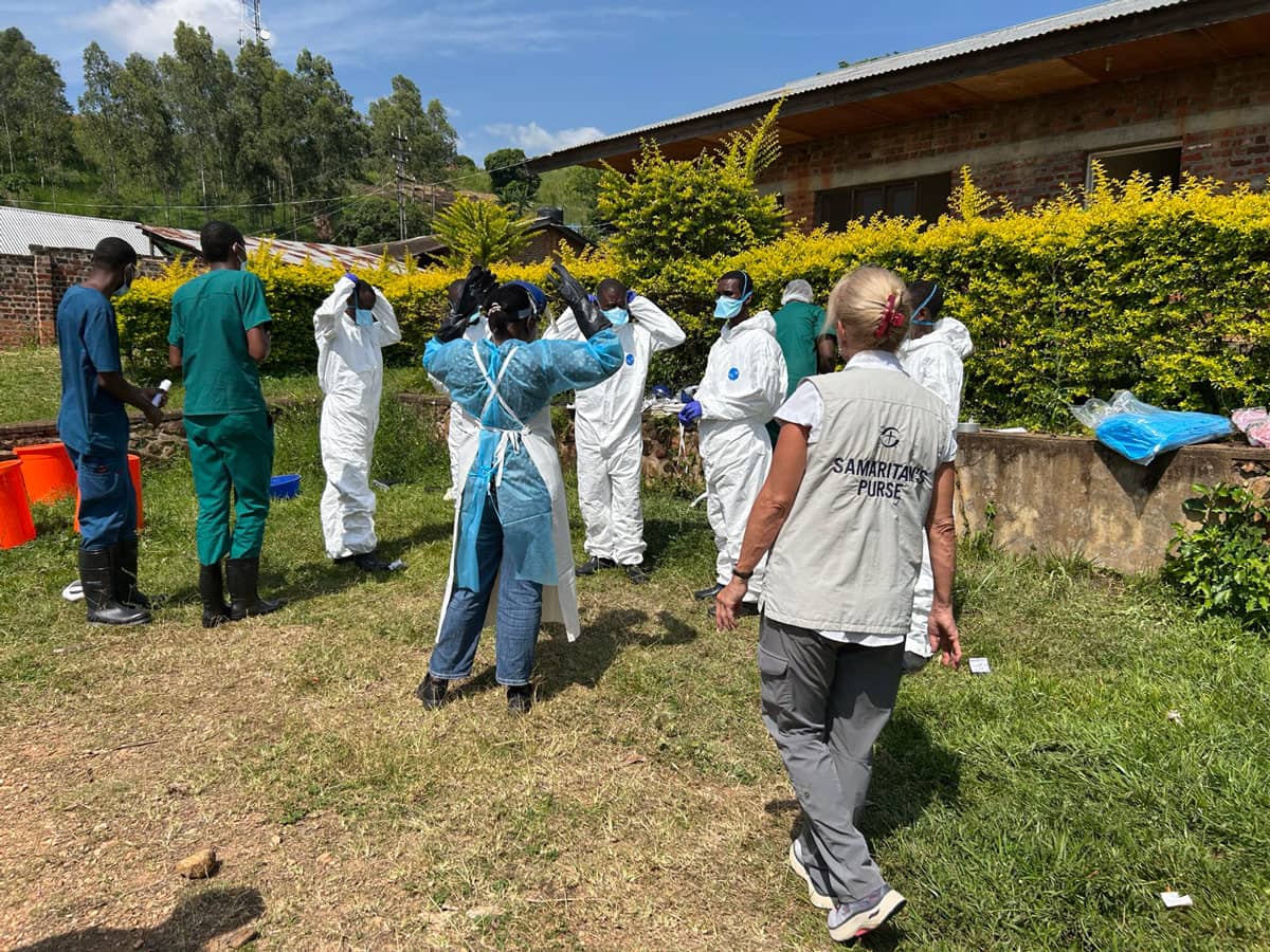 A group of medical workers assisting people with ebola.