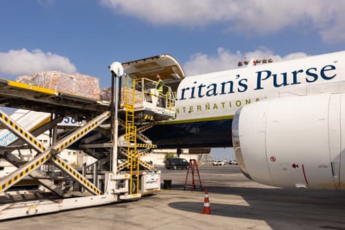 Airplane being loadded with cargo.