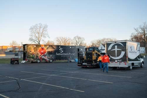 Samaritan's Purse trucks in parking lot.