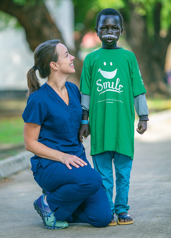 Nurse smiling with patient.